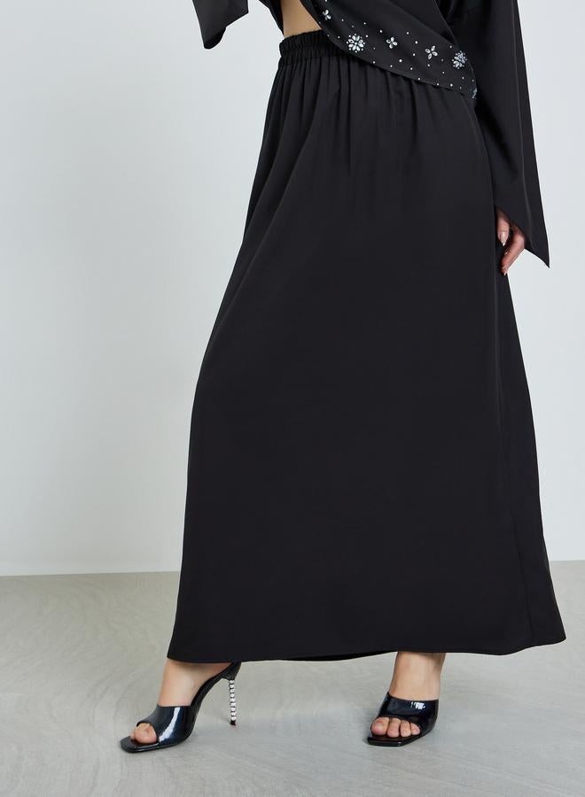 ستايلي طقم منسق من بلوزة مزينة وتنورة طويلة - Image 3